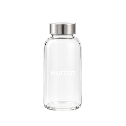 Hurom clear glass bottle with silver lid on a transparent background