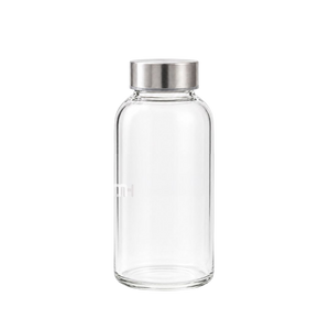 Hurom clear glass bottle with silver lid on a transparent background