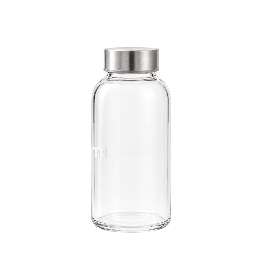 Hurom clear glass bottle with silver lid on a transparent background